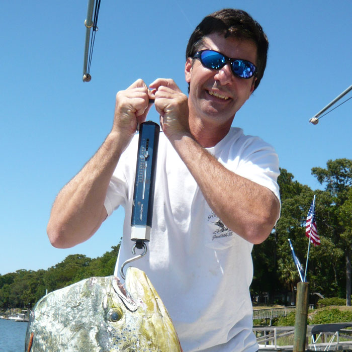 Owner Aaron Dowell holding fish